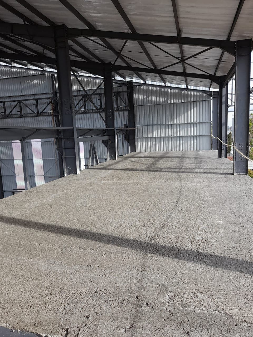 Steel framing and concrete flooring inside a Dunhill industrial construction project